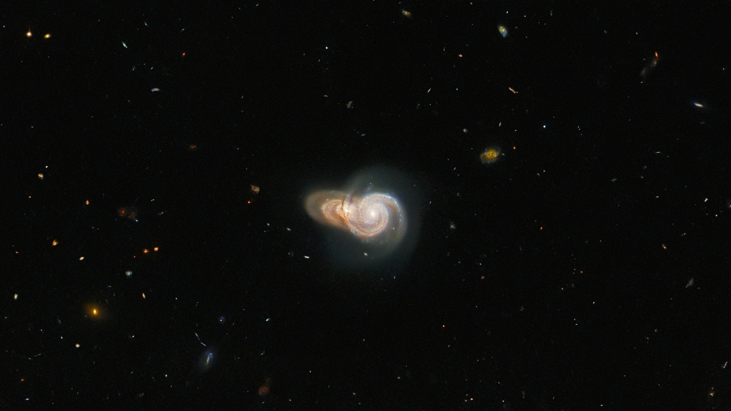Hubble captures two galaxies overlapping each other to form stunning interstellar snail