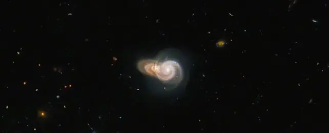 Hubble captures two galaxies overlapping each other to form stunning interstellar snail
