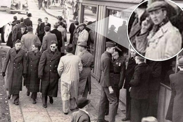 Time Traveler A man with a mobile phone in a 1943 photograph