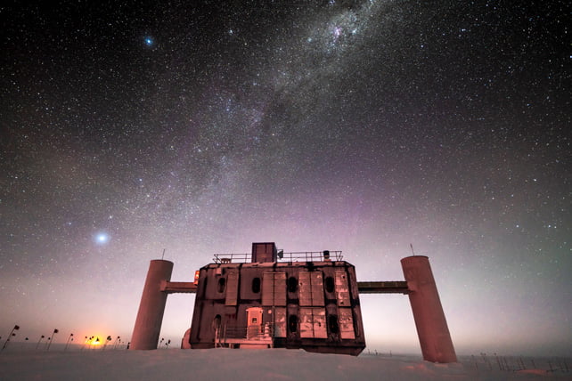 We have detected ghost particles emanating from the heart of a dusty galaxy