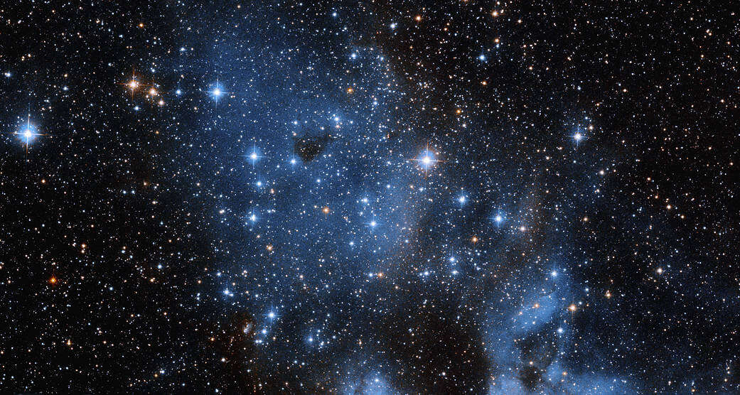Hubble Space Telescope captured an open cluster with an emission nebula