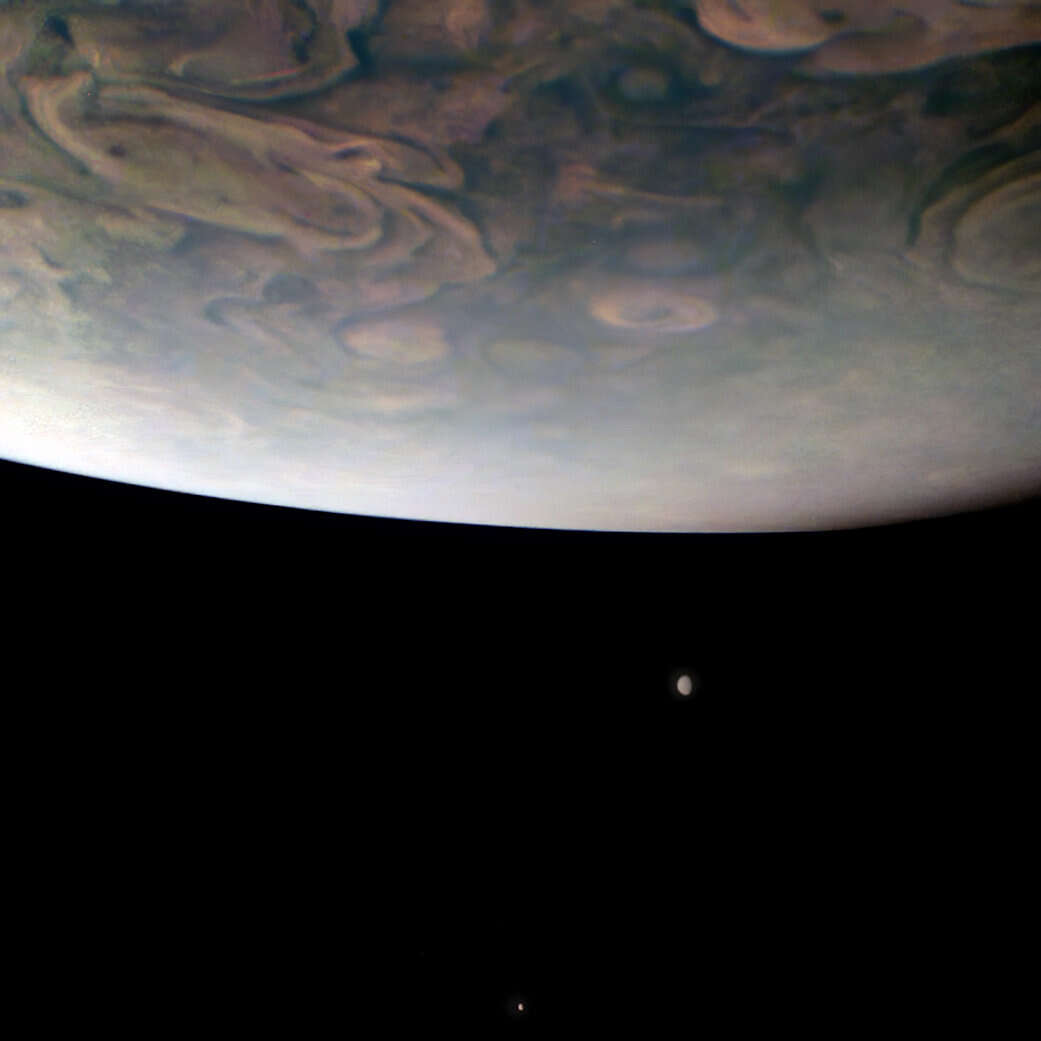NASAs Juno mission captures two of Jupiters moons