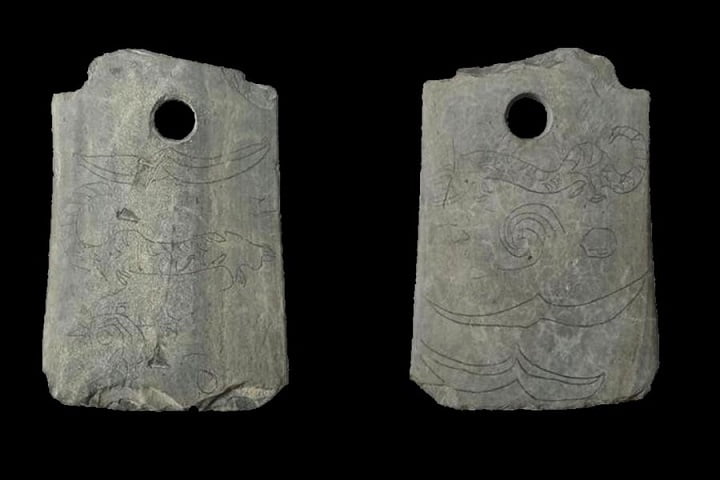 Ancient ritual ax with unusual engraving discovered in China