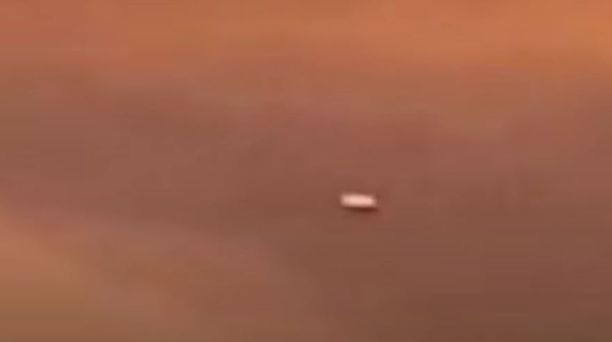Cigar shaped UFO over California captured from a passenger plane 2