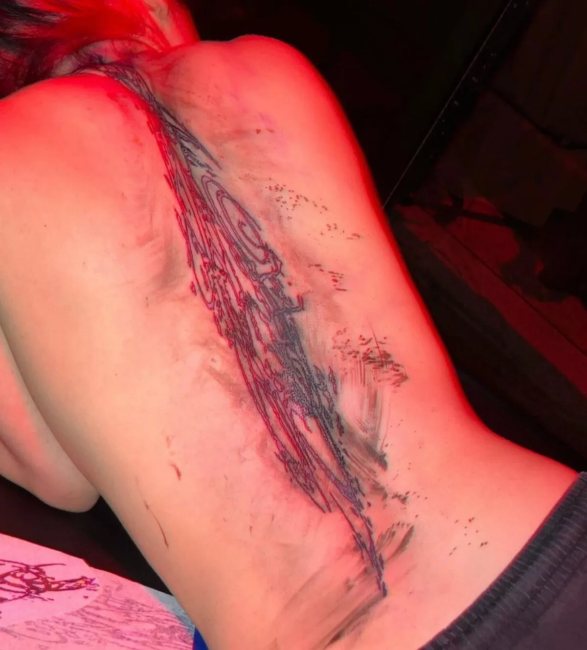 Billie Eilish reveals massive hidden tattoo in topless photo 2