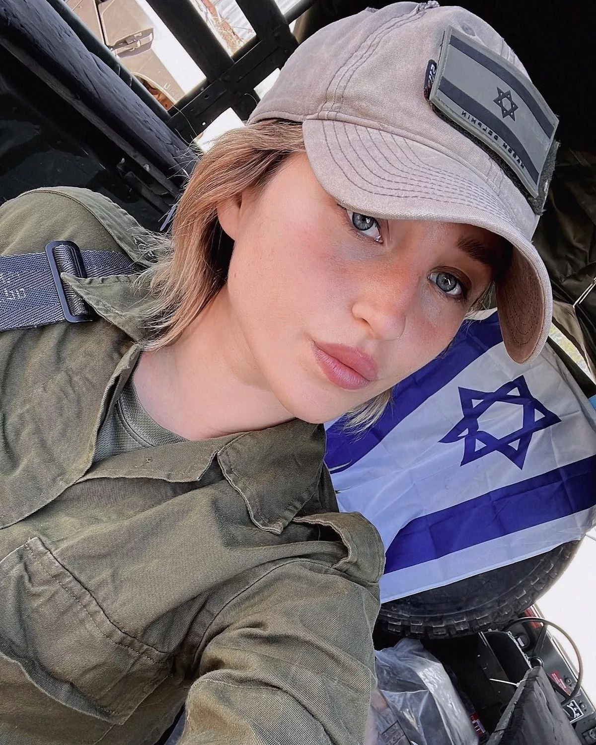 Amidst war, Israel's 'Queen of Guns' resumes posting racy content, asserting that 'life goes on' (4)